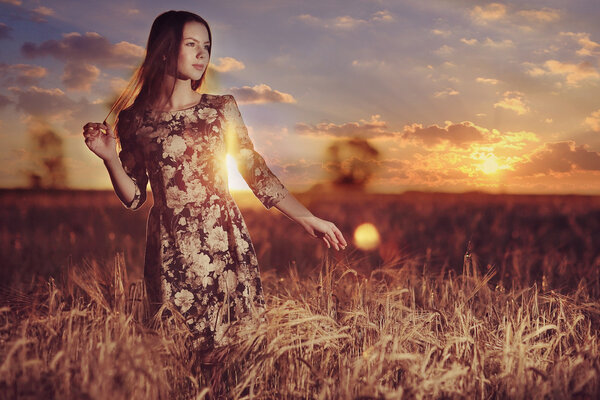 girl at  sunset in  field