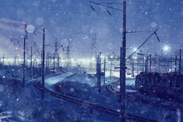 Winter night view of the railway — стоковое фото