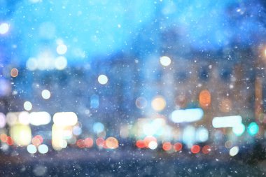 Soyut kar arka planda bulanık şehir ışıkları, kış tatili yeni yıl