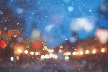 Soyut kar arka planda bulanık şehir ışıkları, kış tatili yeni yıl