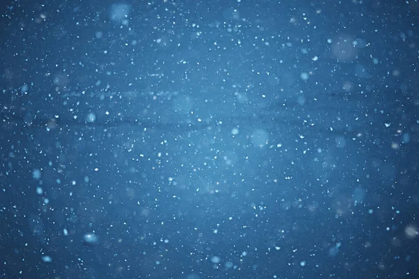 blurred background snowfall nature, abstract falling snowflakes design