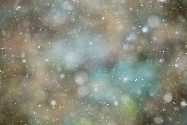 colorful background snow snowfall evening christmas lights, soft light blurry