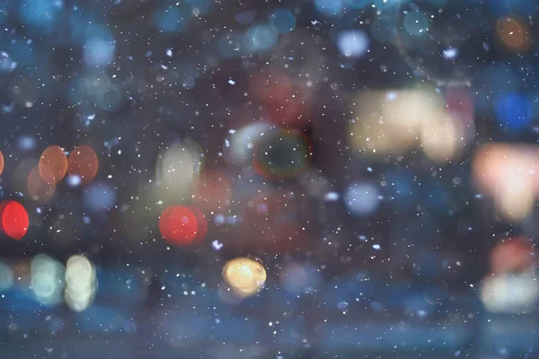 Soyut kar arka planda bulanık şehir ışıkları, kış tatili yeni yıl