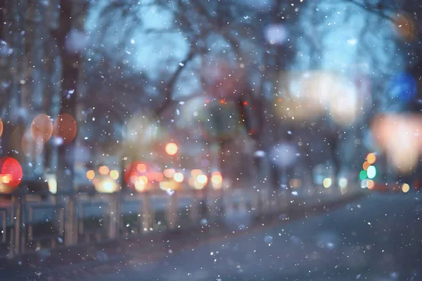 Soyut kar arka planda bulanık şehir ışıkları, kış tatili yeni yıl