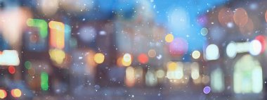 Soyut kar arka planda bulanık şehir ışıkları, kış tatili yeni yıl