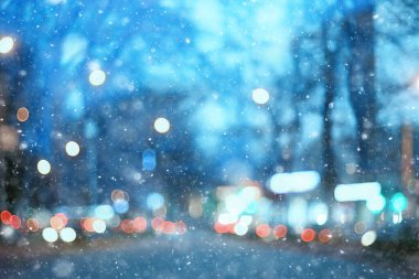 Soyut kar arka planda bulanık şehir ışıkları, kış tatili yeni yıl