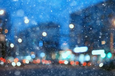 Soyut kar arka planda bulanık şehir ışıkları, kış tatili yeni yıl