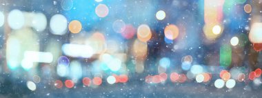 Soyut kar arka planda bulanık şehir ışıkları, kış tatili yeni yıl