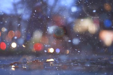 Soyut kar arka planda bulanık şehir ışıkları, kış tatili yeni yıl