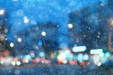 Soyut kar arka planda bulanık şehir ışıkları, kış tatili yeni yıl