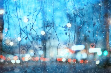 Soyut kar arka planda bulanık şehir ışıkları, kış tatili yeni yıl