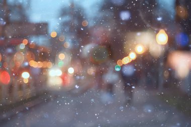 Soyut kar arka planda bulanık şehir ışıkları, kış tatili yeni yıl