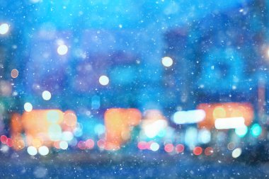 Soyut kar arka planda bulanık şehir ışıkları, kış tatili yeni yıl