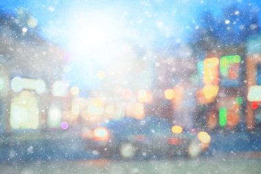Soyut kar arka planda bulanık şehir ışıkları, kış tatili yeni yıl