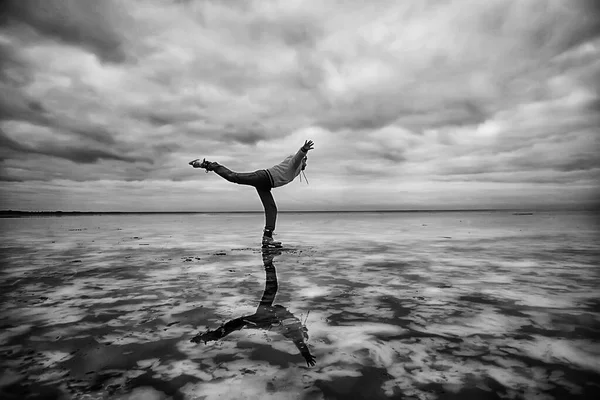 one guy skates on the ice of a frozen lake, nature landscape, man outdoor sports