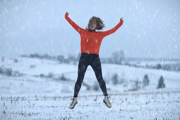 winter snow field woman happiness jumping and running in the field, new year holidays vacation freedom concept
