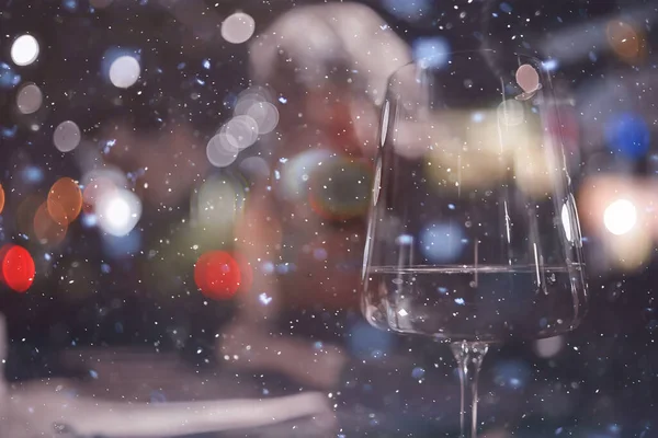 restaurant table view evening wine glass, friends at the party