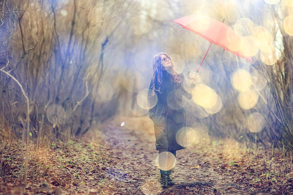 Seasonal autumn portrait, sad girl with umbrella, november seasonal virus immunity on a walk