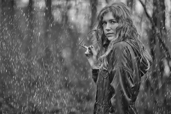seasonal autumn portrait, sad girl with umbrella, november seasonal virus immunity on a walk