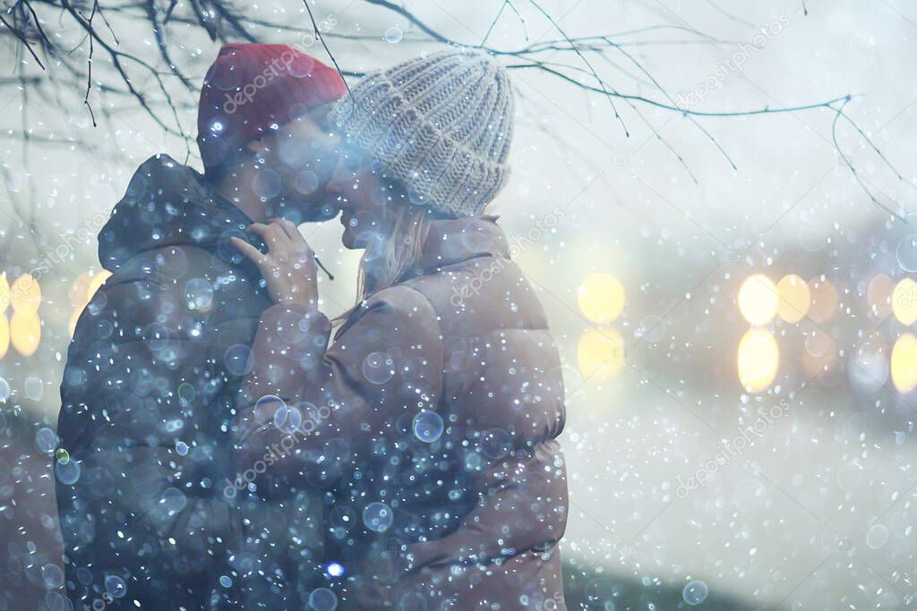 couple in love winter evening hugging outside, seasonal abstract background, weather twilight rain