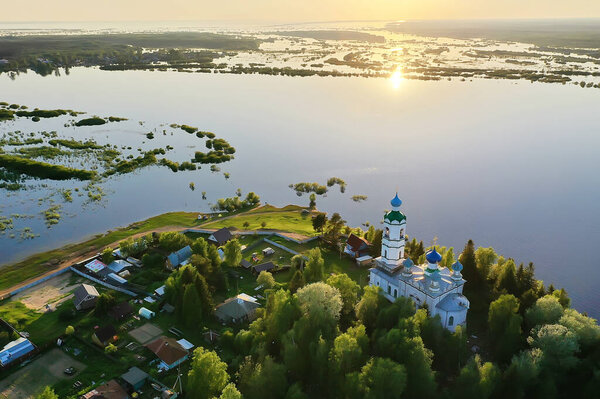 summer landscape in russia sunset, church on the banks of the river christianity orthodoxy