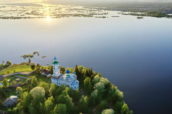 summer landscape in russia sunset, church on the banks of the river christianity orthodoxy