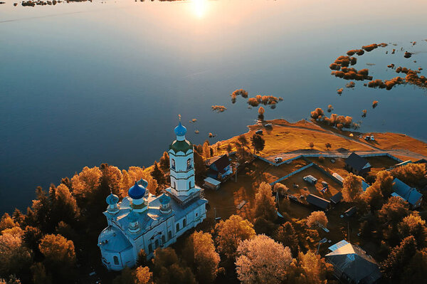 summer landscape in russia sunset, church on the banks of the river christianity orthodoxy