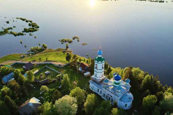 summer landscape in russia sunset, church on the banks of the river christianity orthodoxy