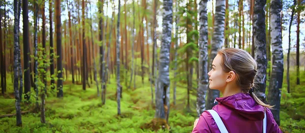 spring forest female windbreaker trekking, springtime rest nature landscape background woman tourist