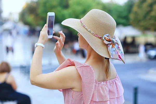 tourism summer old town female, europe mediterranean, young woman traveler, back straw hat view