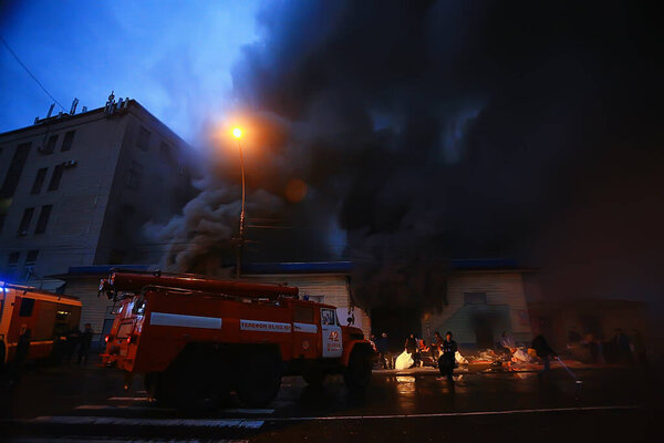 Vologda, Russia - September 16: Fire red truck night city fire, smoke, emergency, September 16, 2017 Vologda, Russia