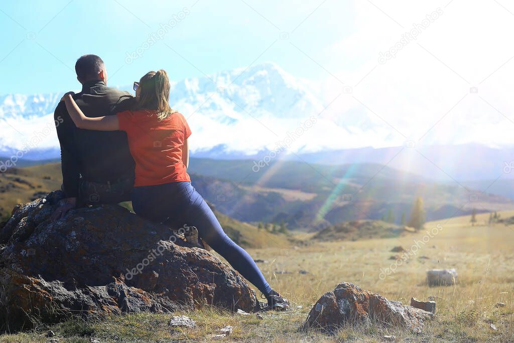 couple hugging in mountains landscape, romance happiness adventure together active