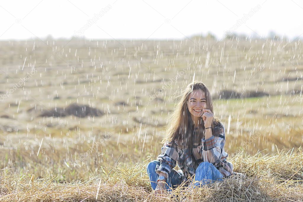 happy young female girl portrait in summer rain country style