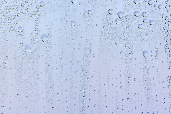 drops glass blue background abstract, transparent cold background water splashes