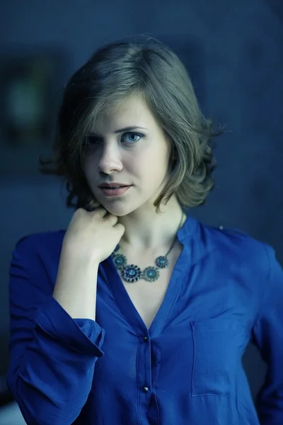 Brunette woman in blue shirt — Stock Photo, Image