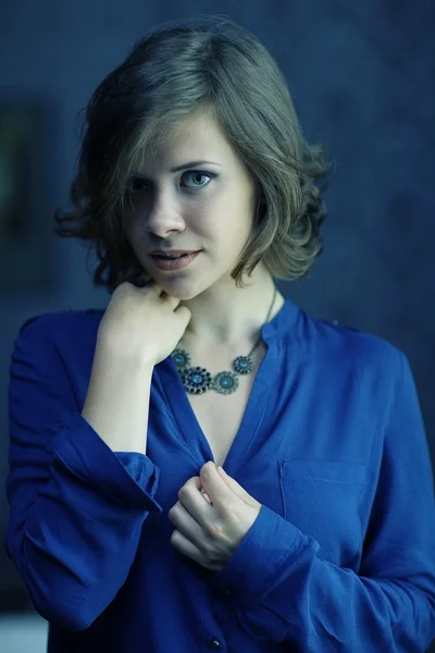 Brunette woman in blue shirt — Stock Photo, Image