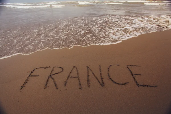 França inscrição na areia — Fotografia de Stock