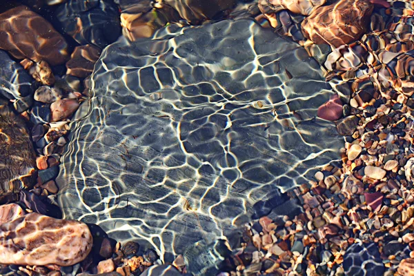 Su altında çakıl taşları — Stok fotoğraf