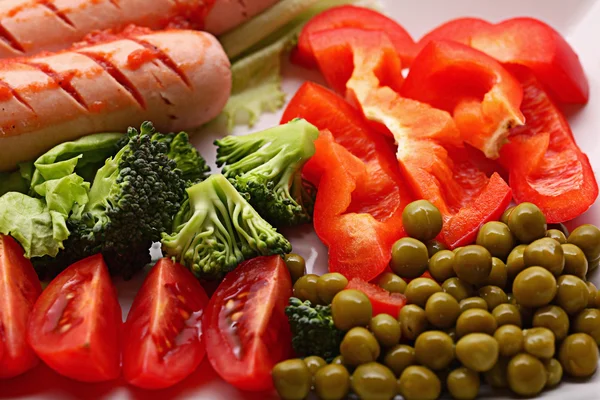 Sausages and vegetables — Stock Photo, Image