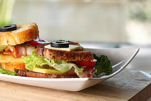 Toasts with bacon and herbs — Stock Photo, Image