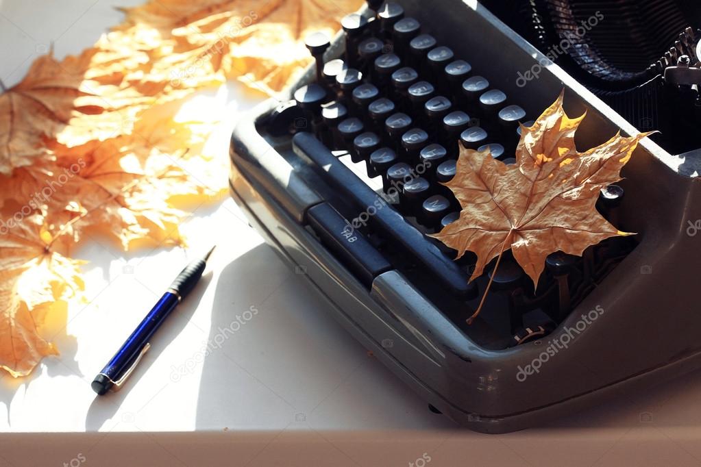 Typewriter  with autumn leaf
