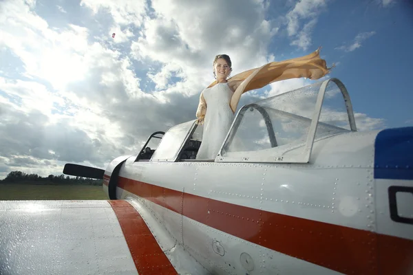 Girl in small plane — Stock Photo, Image