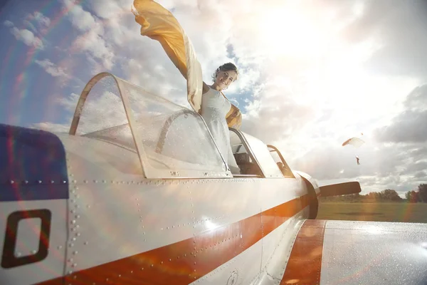 Girl in small plane — Stock Photo, Image