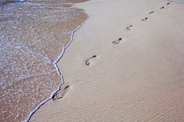 Footprints on sea beach clipart