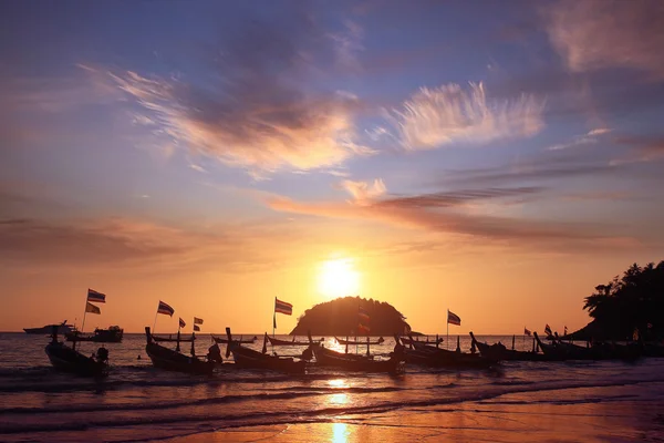 Boats at sunset beach Royalty Free Stock Images