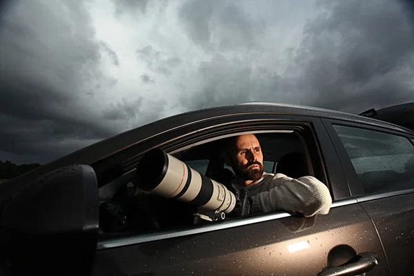 Photographer travelling in car — Stock Photo, Image