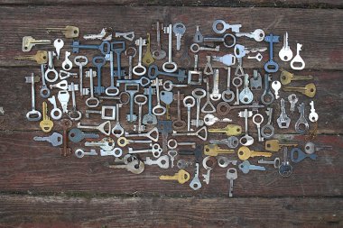 Keys on wooden background clipart
