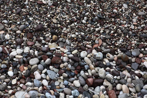 Stenen op het strand textuur — Stockfoto