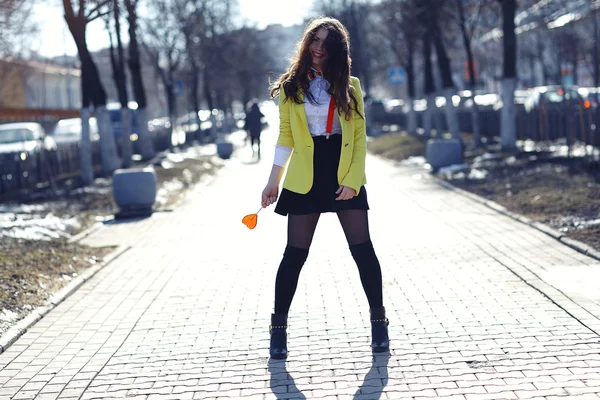 Girl holding heart shaped candy — Stock Photo, Image