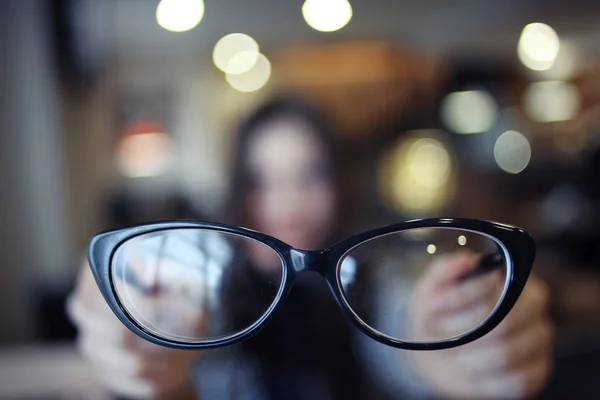 Eye glasses in hands — Stock Photo, Image